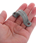 Killer Grip 20 Pack PVC Pipe Clamps Half Inch Conduit Straps held in hand showing heavy duty grey plastic mount for wiring.