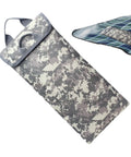 Go-To Hydration Bladder Carrier with 600D Oxford camouflage thermal sleeve, laid on a plaid background.