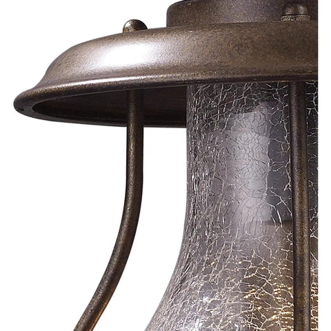 Close-up of Wikshire 8 Inch Wide 1 Light Outdoor Pendant in Coffee Bronze with crackle glass detailing and cast aluminum.