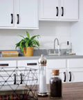 Parkwood Two Handle Kitchen Faucet Deck Mount in Stainless with Aerated and Spray Options, ADA Compliant, shown in kitchen setting