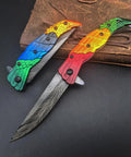 Colorful Eagle Head Embossed Folding Pocket Knife With Damascus Pattern Blade EDC Everyday Carry Utility Knife pictured open and closed.