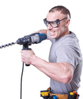 Man using a power drill, showcasing Heavy Duty Sds Plus Auger Drill Bits In A Three Pack At 1-1/8 Inch By 20 Inch Made From Hardened Alloy Steel With Sharp Dual Edges Crafted To Slice Through Wood And Composites Like Butter Every Single Time.