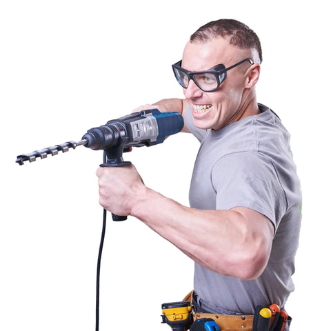 Man using a power drill, showcasing Heavy Duty Sds Plus Auger Drill Bits In A Three Pack At 1-1/8 Inch By 20 Inch Made From Hardened Alloy Steel With Sharp Dual Edges Crafted To Slice Through Wood And Composites Like Butter Every Single Time.