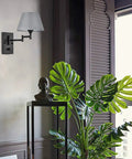 Plug-In Wall Sconce Set Of 2 With Swing-Arm Lamps, Grey Fabric Shade, Black Finish in stylish living room setting