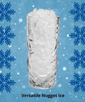 Glass filled with versatile nugget ice, ideal for drinks, against a snowy blue background.
