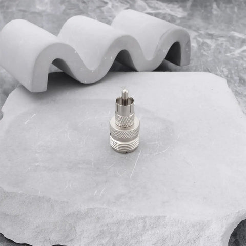 UHF SO239 Female To RCA Male Coax Connector Adapter For Ham Radios And Heathkit Gear on gray stone texture