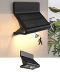 Solar Motion Sensor Security Light Outdoor With Lens LED Waterproof Wireless Wall Light mounted on wall with solar panel visible