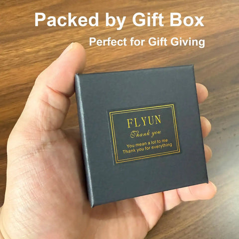 Hand holding stylish black gift box for 18k Gold Large V Shaped Dangle Earrings For Women, perfect for gifting.