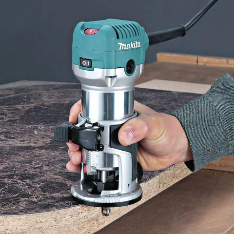 RT0701CR 1-1/4 HP Compact Router With Variable Speed 10,000 To 30,000 RPM being used for precise cabinetry cut