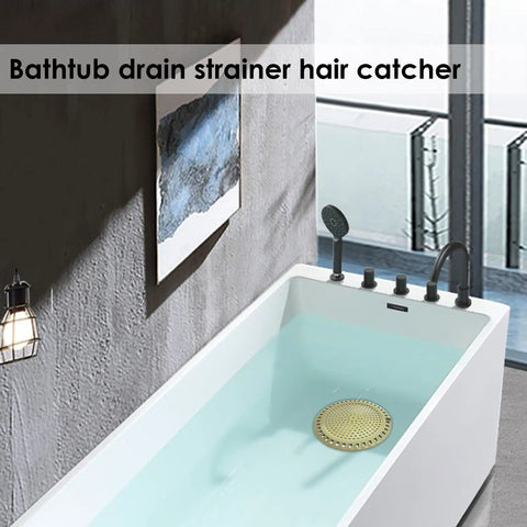 Gold Stainless Steel Shower Drain Catcher With Soft Silicone Edge Flat Round Tub Strainer in a modern bathtub.