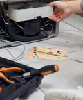 Heavy Duty Freezer Door Hinges Replacement Kit With Spring And Outer Shell, Iron Construction on floor with tools
