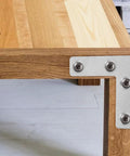 Heavy Duty L Shaped Corner Brackets Set, 36 Stainless Steel Mounting Braces for Cabinets and Furniture installed on wooden table