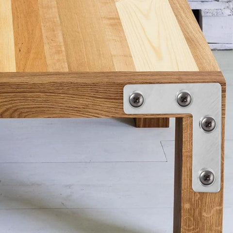 Heavy Duty L Shaped Corner Brackets Set, 36 Stainless Steel Mounting Braces for Cabinets and Furniture installed on wooden table
