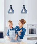 Blue Glass Pendant Lights For Kitchen Island, 6.5 Inch Handblown Glass Shades hanging above a kitchen with mother and daughter