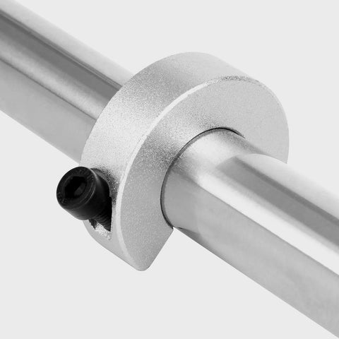 Aluminum shaft collar with clamp-on design and M5 set screw around a round metal shaft