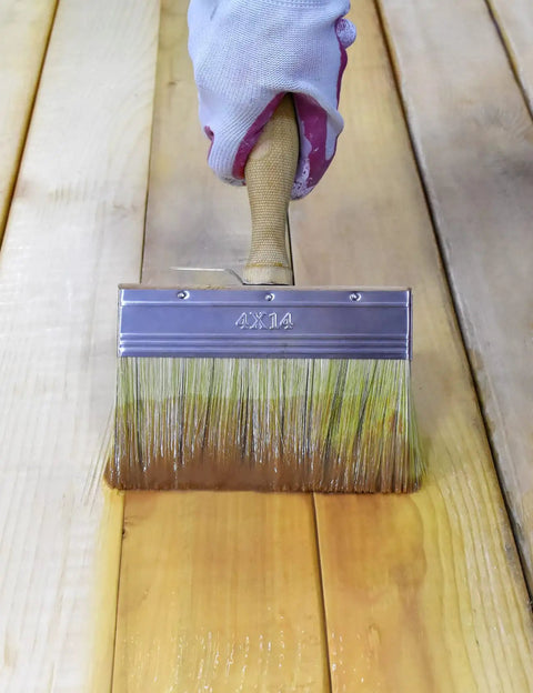 Person using 5.5 Inch Limewash Deck Brush With Wood Handle Large Paint Applicator For Walls Wood Fences And Floors Staining And Painting Ideal For Limewash And Deck Stains on wooden floor