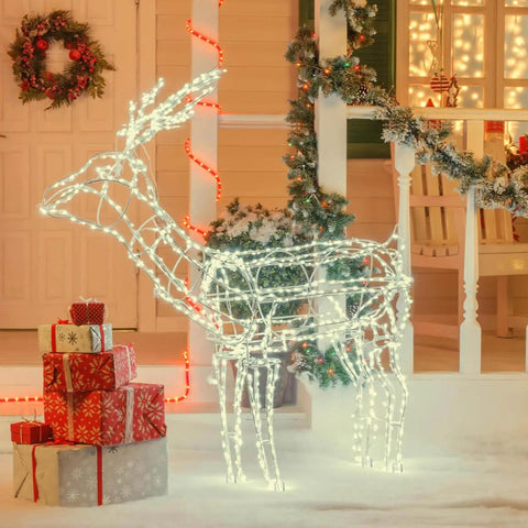 Illuminated wireframe reindeer decoration with Christmas lights and presents on a festive porch.