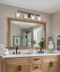 4 Light Vanity Light Fixture In Oil Rubbed Bronze Finish With Clear Glass Cylinders above bathroom mirror, farmhouse style