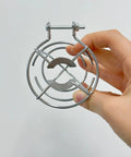 Pair Of Badass Fire Sprinkler Head Guards Made From Rust Resistant Stainless Steel Heavy Duty Cage Covers For One Half And Three Quarter Inch Systems being held.