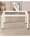 Rock Solid Metal Table Legs Slick Matte Black Industrial Desk Base Heavy Duty Steel Frame With Self Leveling Foot Pads and No Sweat Hardware For Office Or Dining Table Setup displayed from the front on a wooden floor.