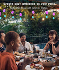 Friends dining under Solar Powered Outdoor String Lights 27ft RGB Color Changing, Dimmable Edison Bulbs, Smart Patio Lighting.