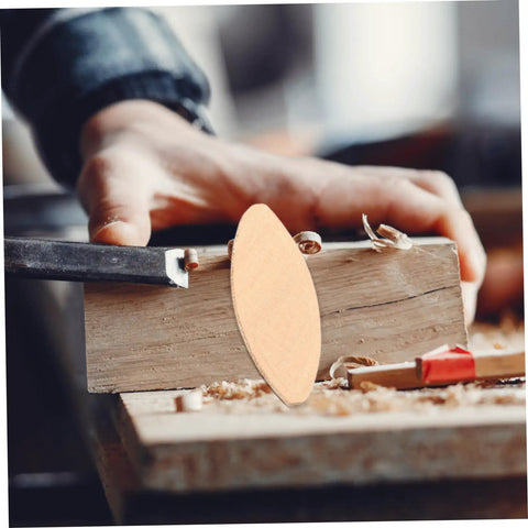 Close-up of 100 Pcs Wood Joiner Biscuits for Precision Woodworking and Furniture Assembly Plate Joiner in woodworking setting