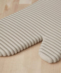Ribbed Soft Silicone Oven Mitts 2 Pack Heat Resistant To 500 Degrees Waterproof Non Slip Handles close up view tan color
