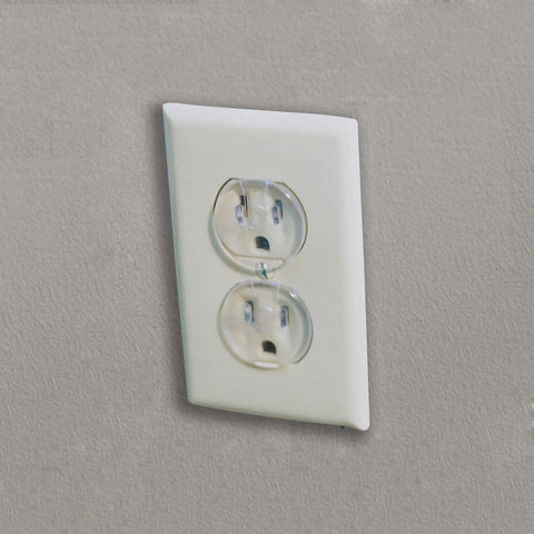 Super Stealthy Child Proof Outlet Covers 12 Pack Ultra Clear Plastic Electrical Safety Plugs in a standard outlet.