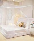 Classic King Size Mosquito Net Tent For Patio Bed, Portable Netting 79 By 79 By 79 Inch installed over a bed indoors.