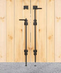 Heavy Duty 12 Inch Steel Gate Drop Rod Two Pack Black Powder Coated Ground Latch on outdoor wooden fence.