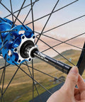Installing Thru Axle Conversion Kit For 15mm To 12mm And 12mm To 9mm Front Hub Adapter on a bike wheel.