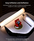 Bi Color 20W Inflatable LED Tube Light for on-the-go filming shown inflated, with magnetic mount displayed on round table.