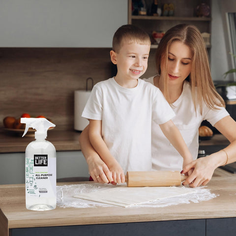 Mother and child in kitchen with All Purpose Cleaner Spray For Home And Kitchen Multipurpose Multisurface Cleaner For Glass Countertops Appliances Upholstery And More Unscented 32oz Pack Of 2 on countertop.