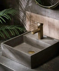 UMJIGF Vessel Sink Small Apartment Above Counter Basin Concrete Wash Basin Single Basin with stylish faucet and greenery.