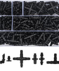Irrigation fittings kit, 300 pieces, black plastic barbed connectors for 1/4" tubing in clear organizer box (top-down view).