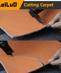 Using Six-Piece Oscillating Tool Hook Knife Blade Set for cutting carpet, showing close-up of tool in action with orange material