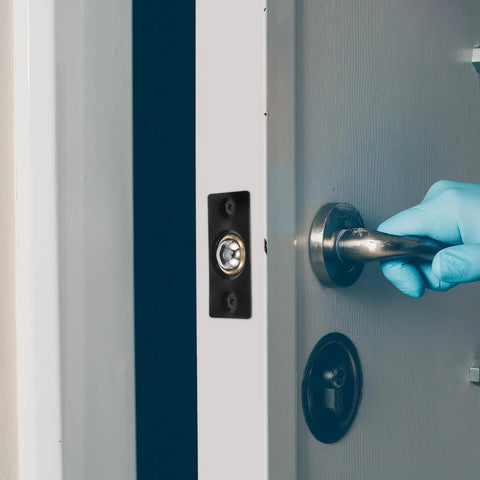 Stainless Steel And Copper Ball Door Catch Hardware Kit With Adjustable Spring And Hidden Positioning Mechanism installed on door
