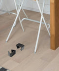 Four Pack Outdoor Furniture Clips For Woven Sectionals on floor by chair