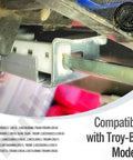 Close-up of CR12 Lawn Tractor Steering Rack Kit installed on Troy-Bilt model, showing metal components and gear mechanism.