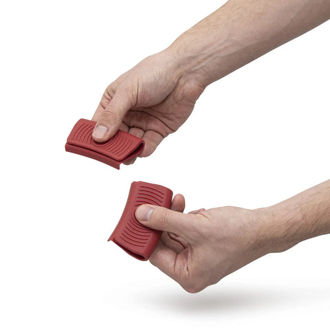 Badass Heavy Duty Dutch Oven Lid Lifter And Compact Folding Stand Equipped With Heat Resistant Silicone Grips for safe lid handling.