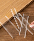 Clear Five Thousand Pcs One Inch Tagging Gun Fasteners Not Jam Refill for All Standard Price Tag Guns on wooden table