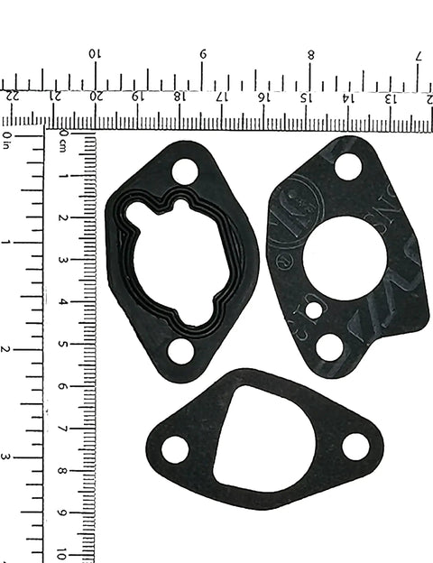 Three gaskets from Two Pack Gasket Kit For Honda GX160 GX200 And Clone Engines And Generators with ruler for scale