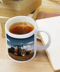 Fantasy Farm Tractor Ceramic Coffee Mug with Large Easy Grip Handle for Coffee and Tea Sippin shown on wooden table