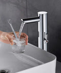 Touchless Bathroom Sink Faucet With Infrared Sensor And Temperature Control Hands Free Tall Body For Commercial Brass Use Adjustable Cold And Hot Water One Hole Single Handle Basin Vessel Auto Water Mixer Chrome Finish in use with glass and toothbrush.