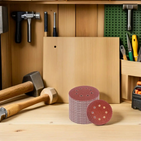 Beaupretty 150 Piece 5 Inch Eight Hole Hook Loop Sanding Discs Assorted Grit For Wood And Metal on a workbench with tools.