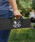 Person holding 'Grill Master' bag for Stainless Steel 4 Piece BBQ Tools Set With Tongs Fork Spatula Brush And Carrying Bag For Grillin Durable Backyard Grillin Gear The Ultimate Gift For Men Dad Husband Birthday outdoors.