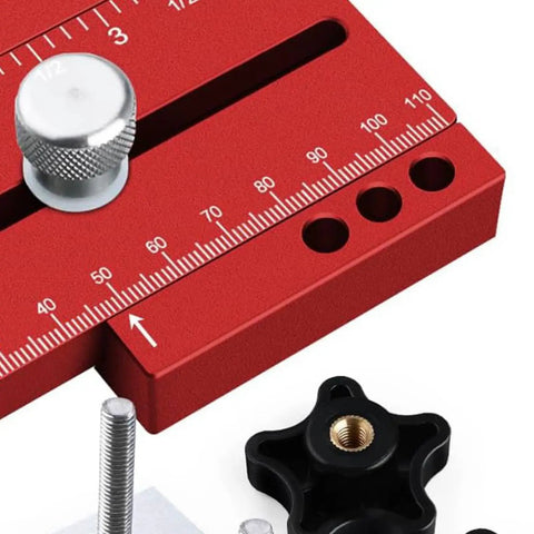 Close-up of red Thin Ripping Jig Made From Aluminum Alloy For Table Saw Router And Band Saw With Wide T Track and ruler markings