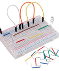 Plug And Play Solderless Breadboard Kit With 130 Piece Grid, 830 Tie Points And 400 Tie Points, Plus 126 Piece Flexible Jumper Wires For Prototyping Electronics Projects showing assembled components with jumper wires and LED on a grid.