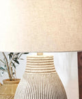 Dope Modern Table Lamp With Textured Paper Composite Base And Modified Drum Shade, beige decor close view.