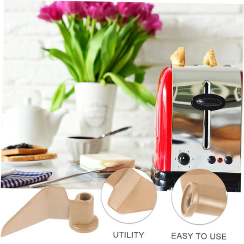 Stirring Paddle Replacement For Bread Maker No Fuss Kneading Paddle With Serrated Edge beside a toaster in kitchen setting
